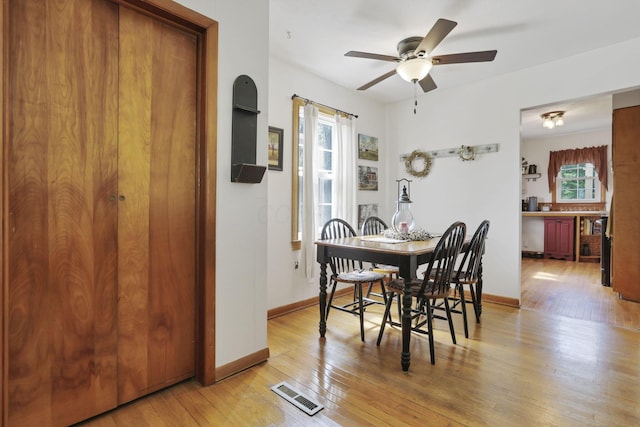 17519 Thompson Ridge Rd, Laurelville, OH 43135 - dining room featuring a ceiling fan and light wood-style floors