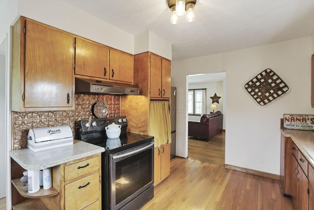 17519 Thompson Ridge Rd, Laurelville, OH 43135 - kitchen featuring electric stove, under cabinet range hood, light wood finished floors, open shelves, and light countertops