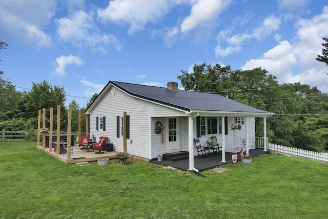 17519 Thompson Ridge Rd, Laurelville, OH 43135 - view of front of home featuring a metal roof, a chimney, an outdoor hangout area, and a wooden deck