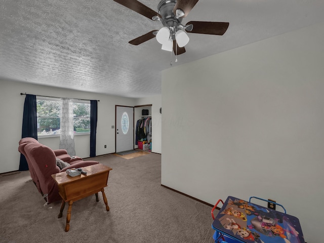 566 Deanna Stroll Rd, Heath, OH 43056 - living area featuring ceiling fan, light carpet, and a textured ceiling