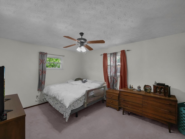 566 Deanna Stroll Rd, Heath, OH 43056 - carpeted bedroom with a textured ceiling and a ceiling fan