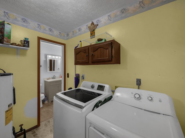 566 Deanna Stroll Rd, Heath, OH 43056 - laundry room with independent washer and dryer, a textured ceiling, electric water heater, and cabinet space