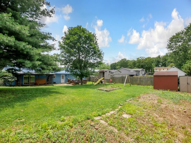 566 Deanna Stroll Rd, Heath, OH 43056 - fenced backyard featuring a playground and a shed