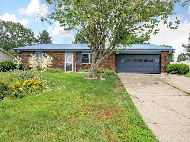 566 Deanna Stroll Rd, Heath, OH 43056 - single story home featuring a garage, concrete driveway, a front yard, brick siding, and a metal roof