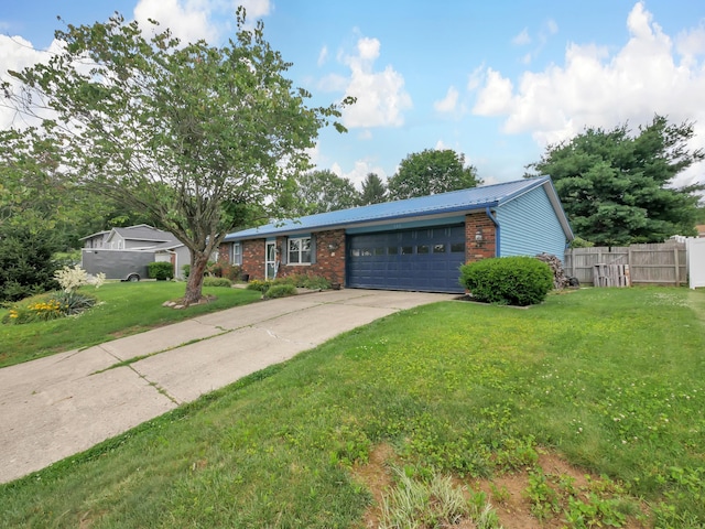 566 Deanna Stroll Rd, Heath, OH 43056 - ranch-style house with an attached garage, brick siding, a metal roof, and driveway