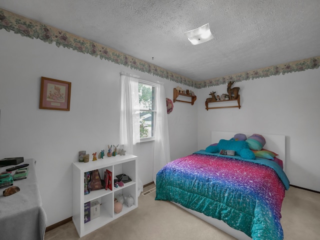 566 Deanna Stroll Rd, Heath, OH 43056 - carpeted bedroom with a textured ceiling and baseboards