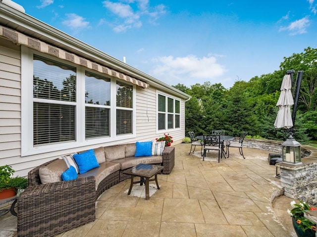 8105 Jitterbug Ln, Pickerington, OH 43147 - view of patio / terrace featuring outdoor dining area and an outdoor living space