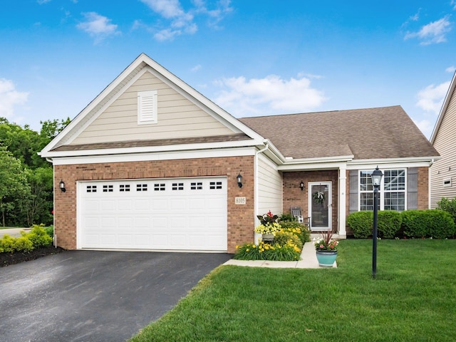 8105 Jitterbug Ln, Pickerington, OH 43147 - view of front of property featuring brick siding, driveway, a front lawn, an attached garage, and roof with shingles