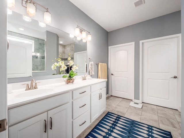 8105 Jitterbug Ln, Pickerington, OH 43147 - bathroom featuring double vanity and tiled shower