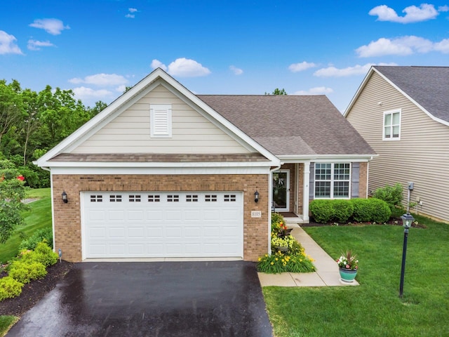 8105 Jitterbug Ln, Pickerington, OH 43147 - view of front facade with brick siding, driveway, a front yard, and a garage