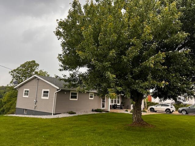 67682 Morristown Flushing Rd, Belmont, OH 43718 - view of side of home featuring a lawn