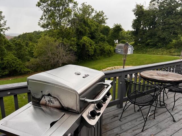 67682 Morristown Flushing Rd, Belmont, OH 43718 - wooden terrace with grilling area, a yard, and an outdoor structure