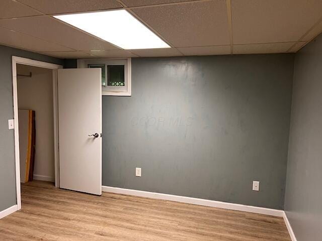 67682 Morristown Flushing Rd, Belmont, OH 43718 - finished basement with a paneled ceiling and light wood-style flooring