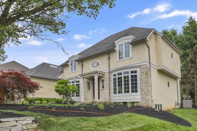 4329 Wyandotte Woods Blvd, Dublin, OH 43016 - french country style house with stucco siding, stone siding, and a front yard