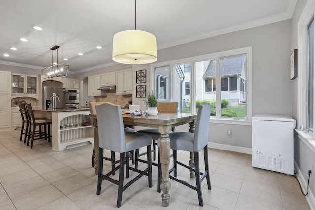4329 Wyandotte Woods Blvd, Dublin, OH 43016 - dining area with crown molding, recessed lighting, light tile patterned floors, and a chandelier