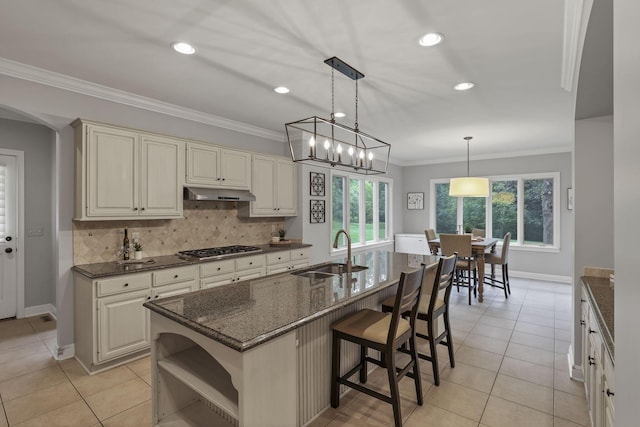 4329 Wyandotte Woods Blvd, Dublin, OH 43016 - kitchen featuring open shelves, healthy amount of natural light, tasteful backsplash, under cabinet range hood, and recessed lighting