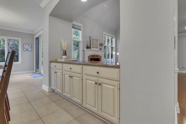4329 Wyandotte Woods Blvd, Dublin, OH 43016 - hall with light tile patterned flooring, ornamental molding, plenty of natural light, and arched walkways