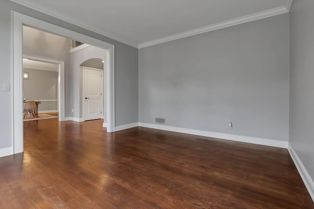 4329 Wyandotte Woods Blvd, Dublin, OH 43016 - empty room featuring arched walkways, crown molding, and dark wood-style flooring