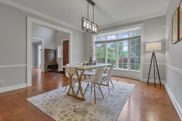 4329 Wyandotte Woods Blvd, Dublin, OH 43016 - dining area featuring healthy amount of natural light, ornamental molding, a chandelier, and wood finished floors