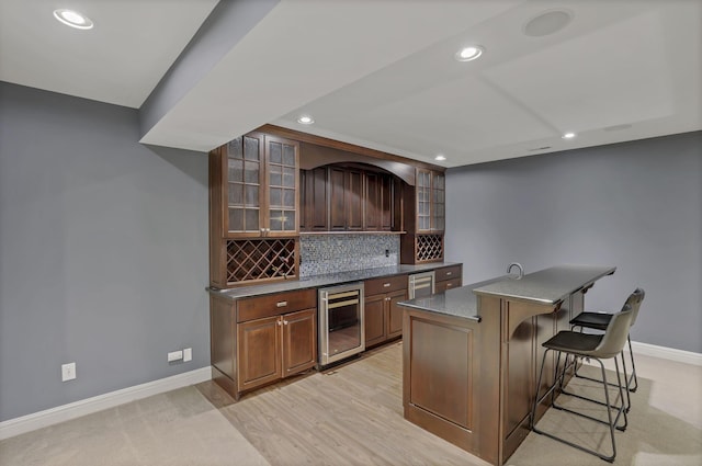 4329 Wyandotte Woods Blvd, Dublin, OH 43016 - indoor wet bar featuring wine cooler, recessed lighting, and backsplash