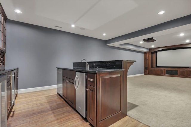 4329 Wyandotte Woods Blvd, Dublin, OH 43016 - kitchen featuring dishwasher, open floor plan, a kitchen island with sink, light wood-style floors, and recessed lighting