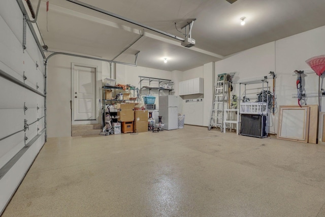 4329 Wyandotte Woods Blvd, Dublin, OH 43016 - garage featuring freestanding refrigerator and a garage door opener