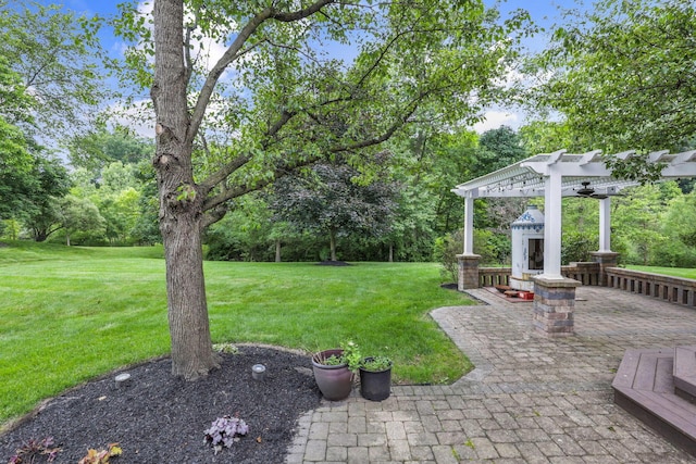 4329 Wyandotte Woods Blvd, Dublin, OH 43016 - view of grassy yard with a pergola, view of scattered trees, and a patio area