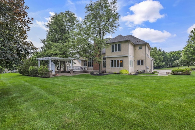 4329 Wyandotte Woods Blvd, Dublin, OH 43016 - rear view of house featuring a pergola, a yard, and stucco siding