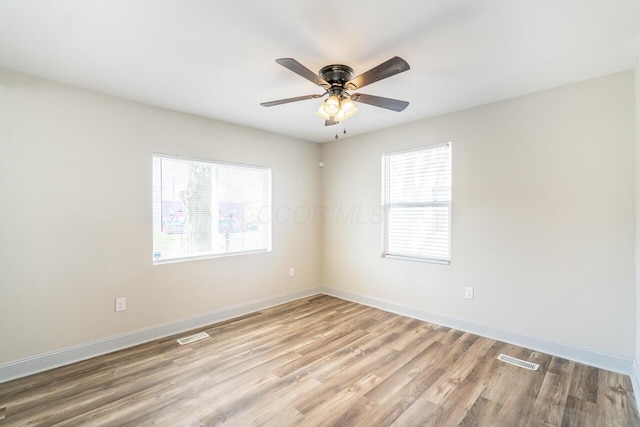 1096 E 22nd Ave Unit 1098, Columbus, OH 43211 - spare room with light wood finished floors and a ceiling fan