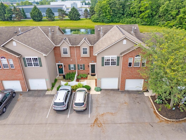 786 Spring Valley Dr, Lewis Center, OH 43035 - view of front of home featuring brick siding, a garage, and driveway