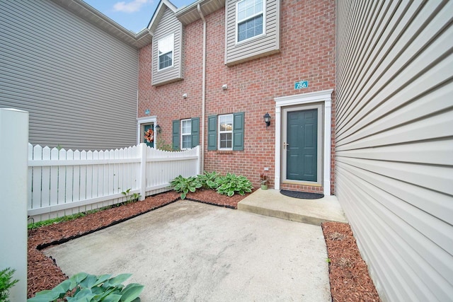 786 Spring Valley Dr, Lewis Center, OH 43035 - view of exterior entry featuring brick siding and a patio area