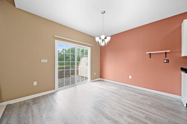 786 Spring Valley Dr, Lewis Center, OH 43035 - unfurnished room featuring light wood-type flooring and a chandelier