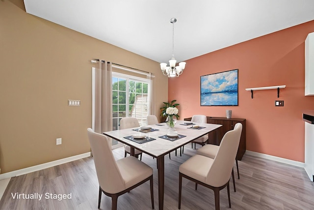 786 Spring Valley Dr, Lewis Center, OH 43035 - dining space with a chandelier and light wood-style flooring