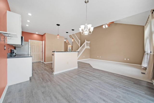 786 Spring Valley Dr, Lewis Center, OH 43035 - kitchen with a chandelier, light wood-style floors, recessed lighting, dark countertops, and decorative light fixtures