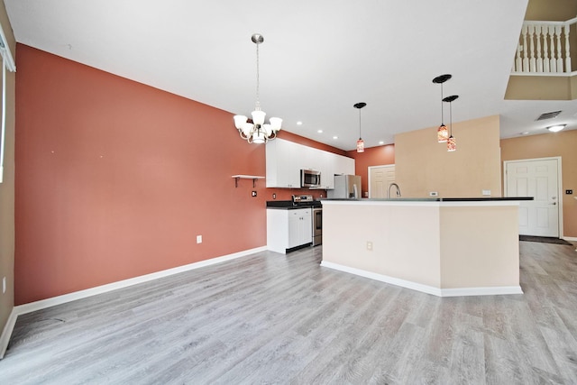 786 Spring Valley Dr, Lewis Center, OH 43035 - kitchen with appliances with stainless steel finishes, light wood-style floors, white cabinets, a chandelier, and pendant lighting
