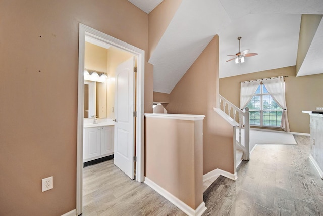 786 Spring Valley Dr, Lewis Center, OH 43035 - hallway featuring light wood-type flooring and vaulted ceiling