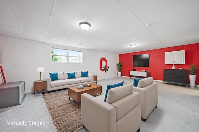 786 Spring Valley Dr, Lewis Center, OH 43035 - living room with concrete block wall, a paneled ceiling, and concrete flooring