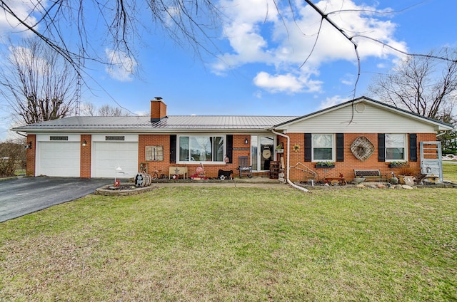1849 Old Springfield Rd, New Holland, OH 43145 - ranch-style house featuring brick siding, asphalt driveway, an attached garage, a chimney, and a front yard