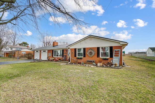 1849 Old Springfield Rd, New Holland, OH 43145 - view of front facade featuring brick siding, driveway, an attached garage, and a chimney