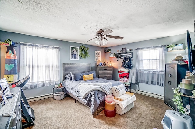 1849 Old Springfield Rd, New Holland, OH 43145 - carpeted bedroom featuring baseboard heating, a textured ceiling, and a ceiling fan