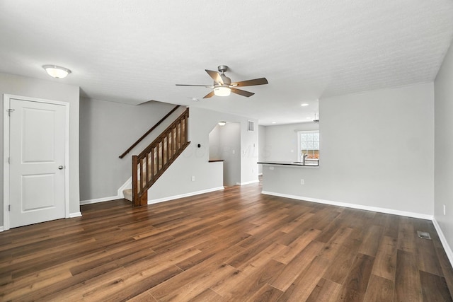 5632 Middle Falls St, Dublin, OH 43016 - unfurnished living room featuring a ceiling fan, dark wood finished floors, stairs, and recessed lighting