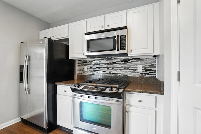 5632 Middle Falls St, Dublin, OH 43016 - kitchen featuring appliances with stainless steel finishes, backsplash, dark wood-style floors, and white cabinetry