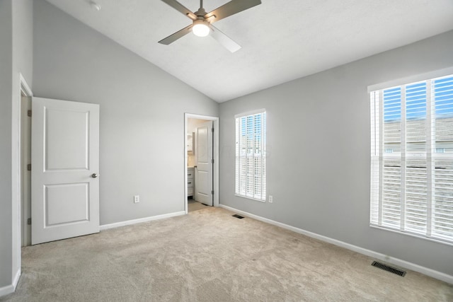 5632 Middle Falls St, Dublin, OH 43016 - unfurnished bedroom with carpet flooring, multiple windows, vaulted ceiling, and a ceiling fan
