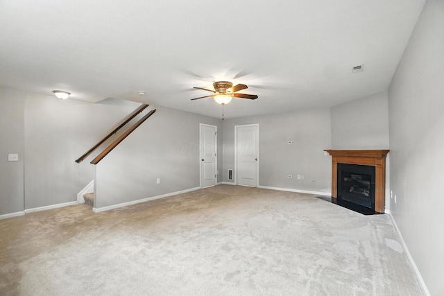 5632 Middle Falls St, Dublin, OH 43016 - unfurnished living room with a ceiling fan, stairway, carpet floors, and a fireplace with flush hearth