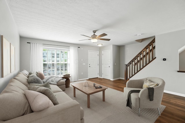 5632 Middle Falls St, Dublin, OH 43016 - living room featuring stairs, wood finished floors, ceiling fan, and a textured ceiling