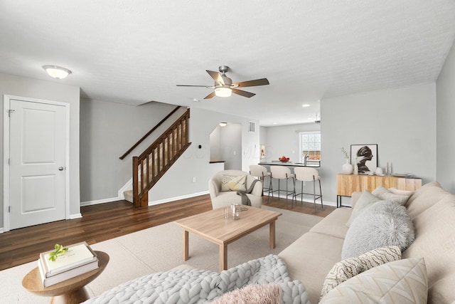 5632 Middle Falls St, Dublin, OH 43016 - living area featuring wood finished floors, stairway, and ceiling fan