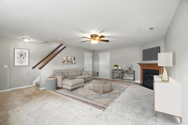 5632 Middle Falls St, Dublin, OH 43016 - carpeted living area featuring stairs, ceiling fan, and a fireplace with flush hearth
