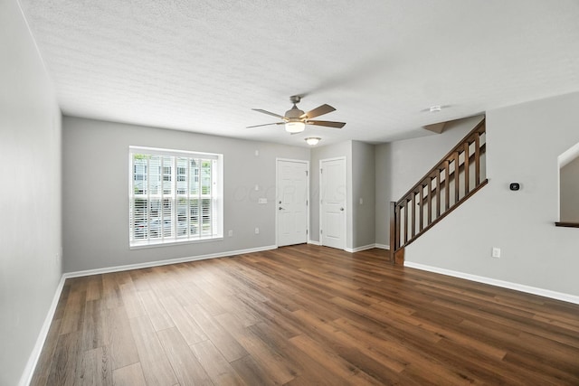5632 Middle Falls St, Dublin, OH 43016 - unfurnished living room with stairs, ceiling fan, wood finished floors, and a textured ceiling