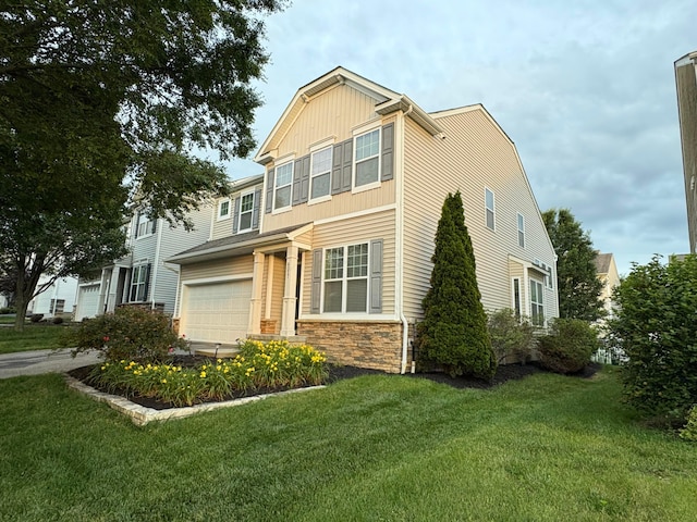 6057 Lakes At Taylor Station Dr, Columbus, OH 43213 - craftsman-style home with a front lawn, stone siding, and an attached garage