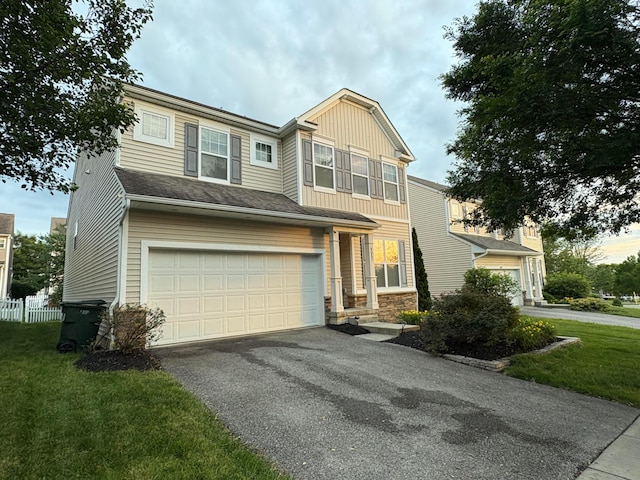 6057 Lakes At Taylor Station Dr, Columbus, OH 43213 - craftsman inspired home with a garage, asphalt driveway, board and batten siding, and stone siding
